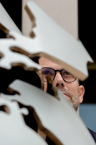 Portrait view of Bouke de Vries peeping through his sculpture in the UCL Japanese garden Copyright ©Richard Stonehouse _0.jpg